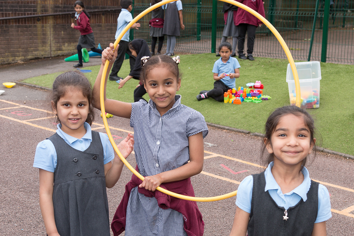 Girls playing with hoop